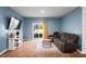 Relaxing living room with a large TV, comfortable seating, and sliding glass doors at 671 Silver Spruce St, Summerville, SC 29486