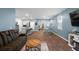 Open living room and dining area with hardwood floors and blue walls at 671 Silver Spruce St, Summerville, SC 29486