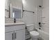 Modern bathroom with white vanity, bathtub, and gray tile at 758 Maynard Ln, Summerville, SC 29486