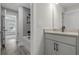 Bathroom with gray herringbone tile and white vanity at 758 Maynard Ln, Summerville, SC 29486