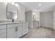 Double vanity bathroom with granite countertop and gray tile at 758 Maynard Ln, Summerville, SC 29486