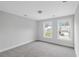 Spacious bedroom with two windows and grey carpet at 758 Maynard Ln, Summerville, SC 29486