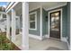 Inviting front porch with white columns and a dark brown front door at 758 Maynard Ln, Summerville, SC 29486