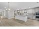 Open concept kitchen features a large island and stainless steel appliances at 758 Maynard Ln, Summerville, SC 29486