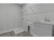 Laundry room with utility sink, shelving, and drain at 758 Maynard Ln, Summerville, SC 29486