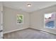 Well-lit bedroom with grey walls, carpet flooring, and a window offering natural light at 780 Maynard Ln, Summerville, SC 29486