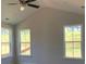 Spacious bedroom with vaulted ceiling, large windows, and ceiling fan at 782 Maynard Ln, Summerville, SC 29486