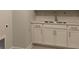 Modern wet bar with white cabinets and a stainless steel sink at 782 Maynard Ln, Summerville, SC 29486