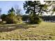 Small cottage-style home partially obscured by vegetation at 8146 N Highway 17, McClellanville, SC 29458