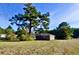 Brick ranch home with mature tree in background at 8146 N Highway 17, McClellanville, SC 29458