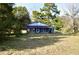 Ranch style home with blue accents and screened porch at 8146 N Highway 17, McClellanville, SC 29458