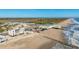 Aerial view of beach homes and a restaurant on the coast at 108 Palmetto Blvd, Edisto Beach, SC 29438