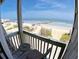 Private balcony with ocean views and seating for two at 108 Palmetto Blvd, Edisto Beach, SC 29438