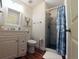 Bathroom with a walk-in shower and white vanity at 108 Palmetto Blvd, Edisto Beach, SC 29438