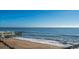 Scenic beach view with a pier and gentle waves at 108 Palmetto Blvd, Edisto Beach, SC 29438