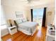 Ocean-view bedroom with hardwood floors and a comfortable bed at 108 Palmetto Blvd, Edisto Beach, SC 29438