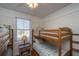 ' bedroom with two wooden bunk beds and a window with blinds at 108 Palmetto Blvd, Edisto Beach, SC 29438