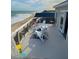 Oceanfront deck with chairs and small table at 108 Palmetto Blvd, Edisto Beach, SC 29438