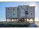 Large beachfront home on stilts with multiple levels and a spacious deck at 108 Palmetto Blvd, Edisto Beach, SC 29438