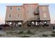 Elevated beach house with parking and ocean views at 108 Palmetto Blvd, Edisto Beach, SC 29438