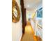 Upstairs hallway with natural light and hardwood floors at 108 Palmetto Blvd, Edisto Beach, SC 29438
