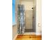 Shower stall with tile surround and glass door at 108 Palmetto Blvd, Edisto Beach, SC 29438