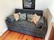 Gray sleeper sofa with decorative pillows at 108 Palmetto Blvd, Edisto Beach, SC 29438