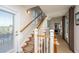 Staircase with white railings, carpeted runner, and hardwood floors at 108 Palmetto Blvd, Edisto Beach, SC 29438