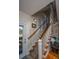 Wooden staircase with white railing and patterned carpet runner at 108 Palmetto Blvd, Edisto Beach, SC 29438