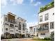 Street view of townhouses, showing landscaping and people at 1150 Valdosta St # 302, North Charleston, SC 29405