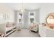 Charming Bedroom featuring a crib, rocker, and plenty of natural light at 1447 Clay Field Trl, Summerville, SC 29485