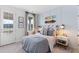 Stylish bedroom with a double bed and a light blue accent wall at 1447 Clay Field Trl, Summerville, SC 29485