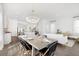 Spacious dining area with a farmhouse table and chandelier at 1447 Clay Field Trl, Summerville, SC 29485