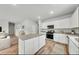 Modern kitchen featuring white cabinetry, granite countertops, and stainless steel appliances at 204 West Bradford Pointe Dr, Summerville, SC 29486