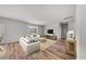 Spacious living room with hardwood floors, neutral walls, and a cozy seating area at 208 West Bradford Pointe Dr, Summerville, SC 29486