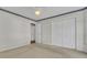 Simple bedroom with carpet flooring and double doors to closet at 2173 Annie Laura Ln, Mount Pleasant, SC 29466