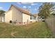 Rear view of house showing metal roof and fenced yard at 2173 Annie Laura Ln, Mount Pleasant, SC 29466