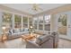 Bright sunroom with ample windows, comfy seating, and tile flooring at 2173 Annie Laura Ln, Mount Pleasant, SC 29466