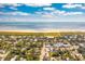 Aerial showcasing home's proximity to beach, town, and ocean at 2220 Ion Ave, Sullivans Island, SC 29482