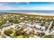 Aerial view of coastal town with beach and houses at 2220 Ion Ave, Sullivans Island, SC 29482