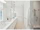 Spa-like bathroom with marble countertops and a walk-in shower at 2220 Ion Ave, Sullivans Island, SC 29482