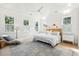 White bedroom with a large bed and light blue bedding at 2220 Ion Ave, Sullivans Island, SC 29482