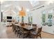 Large dining room with wood table, woven chairs and vaulted ceilings at 2220 Ion Ave, Sullivans Island, SC 29482