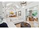 Spacious living room with vaulted ceiling, white shiplap walls, and comfy sectional sofa at 2220 Ion Ave, Sullivans Island, SC 29482