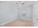 Simple bedroom with neutral walls, carpet flooring, and a window at 313 Oakbend St, Summerville, SC 29486