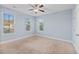 Bright bedroom with neutral walls, carpet flooring, and multiple windows at 313 Oakbend St, Summerville, SC 29486