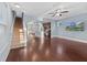 Open living room with hardwood floors, high ceilings, and a view of the kitchen at 313 Oakbend St, Summerville, SC 29486