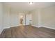Bright bedroom with wood-look floors and access to bathroom at 316 Trailmore Ln, Summerville, SC 29486