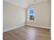Bright bedroom with wood-look flooring and a window with a view at 316 Trailmore Ln, Summerville, SC 29486