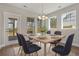 Bright dining room featuring a farmhouse table and access to a backyard patio at 316 Trailmore Ln, Summerville, SC 29486